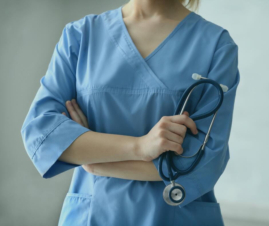 Woman in light blue scrubs